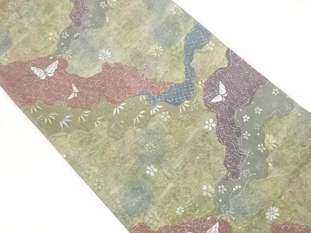Woven pouch obi with floral leaves, butterflies, and blue sea waves pattern